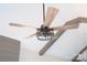 Rustic ceiling fan with decorative cage and exposed ceiling beams at 1432 Blackbird Dr, Clover, SC 29710