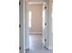 Hallway with an open white door leads to a brightly lit room with natural light at 1432 Blackbird Dr, Clover, SC 29710