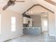 Open-concept floor plan featuring vaulted ceilings and a stylish kitchen with stainless steel appliances at 1432 Blackbird Dr, Clover, SC 29710
