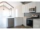 Open-concept kitchen with stainless steel dishwasher, modern appliances, and bright countertops at 1432 Blackbird Dr, Clover, SC 29710