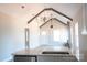Bright living room featuring high ceilings with beams, modern light fixtures, and an open-concept design at 1432 Blackbird Dr, Clover, SC 29710