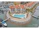 Beautiful aerial view of waterfront condos, pool, and harbor with boats docked nearby at 18009 Kings Point Dr # C, Cornelius, NC 28031