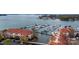 Wide aerial view of a harbor with a building with red roofing and a parking lot nearby at 18009 Kings Point Dr # C, Cornelius, NC 28031