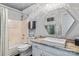 Bathroom featuring a tub, toilet, and a vanity with a marble countertop and modern faucet at 18009 Kings Point Dr # C, Cornelius, NC 28031