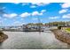 Calm waters and docks line with sailboats in this picturesque harbor scene with a blue sky at 18009 Kings Point Dr # C, Cornelius, NC 28031