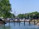Daytime view of marina with lush greenery, boats and calm water at 18009 Kings Point Dr # C, Cornelius, NC 28031