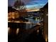 Night view of marina with glowing pier lights reflecting off the still water at 18009 Kings Point Dr # C, Cornelius, NC 28031