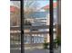 Balcony view overlooking the serene lake and marina with boats at 18009 Kings Point Dr # C, Cornelius, NC 28031