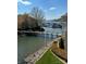 Picturesque waterfront view with a bridge leading to boat slips and condominiums at 18009 Kings Point Dr # C, Cornelius, NC 28031