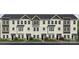 Charming townhome showcasing light siding, black accents, multiple windows, and well-manicured landscaping at 226 E Morehouse Ave # Twnh C, Mooresville, NC 28117