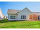 Well-maintained backyard featuring a patio, lush grass, and mature trees at 229 River Birch Dr, Salisbury, NC 28146