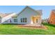 Well-maintained backyard featuring a patio, lush grass, and mature trees at 229 River Birch Dr, Salisbury, NC 28146