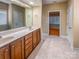 Bright bathroom featuring a double vanity, framed mirror and ceramic tile flooring at 229 River Birch Dr, Salisbury, NC 28146
