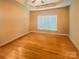 This bedroom features hardwood floors, natural light, and neutral paint at 229 River Birch Dr, Salisbury, NC 28146