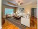 Inviting living room with hardwood floors, a modern ceiling fan, recessed lights, and a cozy seating area at 229 River Birch Dr, Salisbury, NC 28146