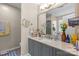 Bathroom vanity with gray cabinets, neutral walls, decorative mirrors, and ample counter space at 2341 Shannon Dr, Belmont, NC 28012