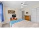 Relaxing bedroom with a comfortable bed, dresser, and blue accents at 2341 Shannon Dr, Belmont, NC 28012