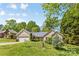 Beautiful one-story home with manicured lawn, mature trees, and a charming front entrance at 2341 Shannon Dr, Belmont, NC 28012