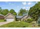 Charming single-story home featuring an attached two-car garage and inviting curb appeal with lush landscaping at 2341 Shannon Dr, Belmont, NC 28012