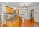 Well-lit kitchen with wooden cabinets, granite countertops, and modern fixtures at 2341 Shannon Dr, Belmont, NC 28012