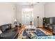 Spacious living room featuring hardwood floors, modern furnishings, and plenty of natural light at 2341 Shannon Dr, Belmont, NC 28012