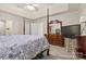 A main bedroom featuring a four-poster bed, neutral walls, and dark wood furniture at 2341 Shannon Dr, Belmont, NC 28012