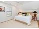 Comfortable bedroom with neutral carpet and light walls, complemented by natural light and stylish decor at 2342 Wesley Landing Rd, Waxhaw, NC 28173