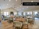 Community clubhouse featuring large tables, comfortable seating, a fireplace, and kitchen area at 2342 Wesley Landing Rd, Waxhaw, NC 28173
