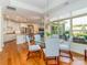 Dining area with a glass table, chandelier, and views of the backyard at 2342 Wesley Landing Rd, Waxhaw, NC 28173