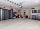 Spacious three car garage with epoxy flooring, overhead storage and custom storage cabinets at 2342 Wesley Landing Rd, Waxhaw, NC 28173