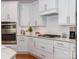 Well-equipped kitchen featuring sleek white cabinetry, stainless steel appliances, and granite countertops at 2342 Wesley Landing Rd, Waxhaw, NC 28173