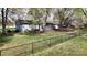 Fenced backyard featuring a deck, mature trees, and plenty of green space at 2482 Kings Grant Rd, Lincolnton, NC 28092