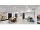 Spacious finished basement area with a dining table, sliding barn door, and ample lighting at 2482 Kings Grant Rd, Lincolnton, NC 28092