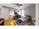 Bedroom with a wooden frame bed, hardwood floors, and blue walls complemented by bright, natural light at 2482 Kings Grant Rd, Lincolnton, NC 28092