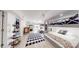 Shared bedroom with built-in bunk beds, wood-look floors, and white shiplap walls at 2482 Kings Grant Rd, Lincolnton, NC 28092