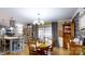 Open concept kitchen and dining area with large windows and gray cabinets at 2482 Kings Grant Rd, Lincolnton, NC 28092
