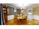 A beautiful dining room showcasing a wooden table set, decorative wallpaper, and stylish furnishings at 2482 Kings Grant Rd, Lincolnton, NC 28092