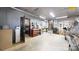 Large garage with vehicle, work bench, shelving, and extra storage space at 2482 Kings Grant Rd, Lincolnton, NC 28092