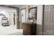 Hallway leading to other rooms with exercise equipment visible through an open doorway at 2482 Kings Grant Rd, Lincolnton, NC 28092