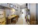 Hallway featuring natural lighting with room for storage, desk and shelves at 2482 Kings Grant Rd, Lincolnton, NC 28092