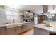 Bright kitchen with stainless appliances, double farmhouse sink, and modern cabinetry and fixtures at 2482 Kings Grant Rd, Lincolnton, NC 28092