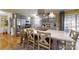 Bright kitchen featuring an island with barstool seating, stainless appliances, and modern gray cabinetry at 2482 Kings Grant Rd, Lincolnton, NC 28092