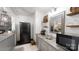 Compact kitchenette featuring gray cabinetry, marble countertops, and a stainless steel sink at 2482 Kings Grant Rd, Lincolnton, NC 28092