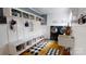 Mudroom-laundry room with built-in shelving, coat hooks, and a sink, plus front loading washer and dryer at 2482 Kings Grant Rd, Lincolnton, NC 28092