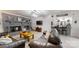 Open living room featuring a stone fireplace, TV, and comfortable leather sofas at 2482 Kings Grant Rd, Lincolnton, NC 28092
