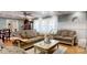 Bright and airy living room with plush sofas, hardwood floors, and large windows at 2482 Kings Grant Rd, Lincolnton, NC 28092