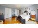 Bedroom featuring hardwood floors, closet doors, and dark wood furniture with white linens at 2482 Kings Grant Rd, Lincolnton, NC 28092
