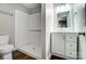 Bathroom featuring a stand-up shower, white vanity, and wood-style floors at 26 Park Dr, Gastonia, NC 28054