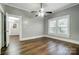 Bedroom showcasing wood-style floors, neutral paint, ceiling fan and natural light at 26 Park Dr, Gastonia, NC 28054