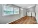 Laundry room area with natural light, washer, dryer, and wood-look flooring at 26 Park Dr, Gastonia, NC 28054